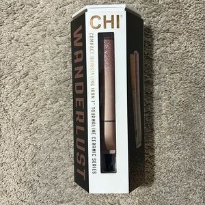 CHI flat iron. New in box. Never removed from box.